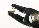 Crimping pliers holding a crimp cover